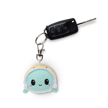 An on-the-go Turtle Plushie Charm Keychain with a portable TeeTurtle turtle plushie.