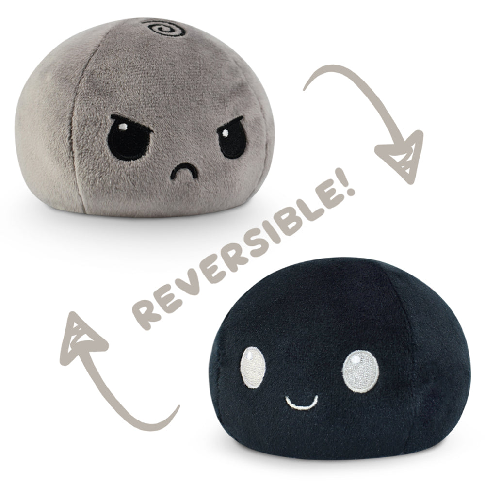 A Reversible Ball Plushie by TeeTurtle in black and grey.