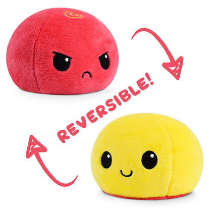 A Reversible Ball Plushie by TeeTurtle in red and yellow.