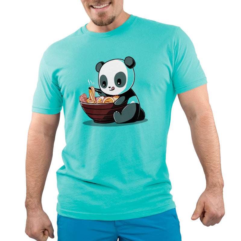 Premium Cotton T-shirt - A person wearing a Caribbean Blue apparel with a printed design of Ramen Panda by monsterdigital, holding a bowl of steaming noodles. The apparel is made from Super Soft Ringspun Cotton. The person's head and lower body are cropped out of the image.