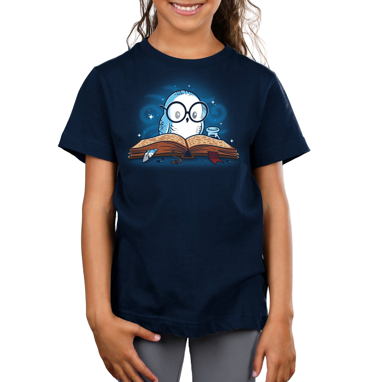 Premium Cotton T-shirt_TeeTurtle navy blue Reading is Magical. Featuring a white owl reading a book.