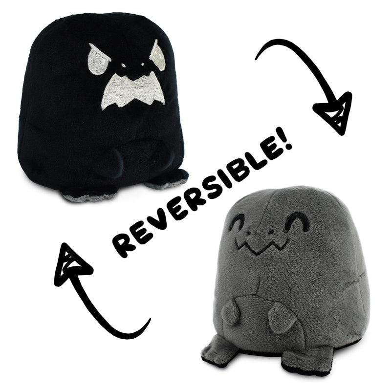 A TeeTurtle Reversible T-Rex Plushie in black and grey resembling a monster.