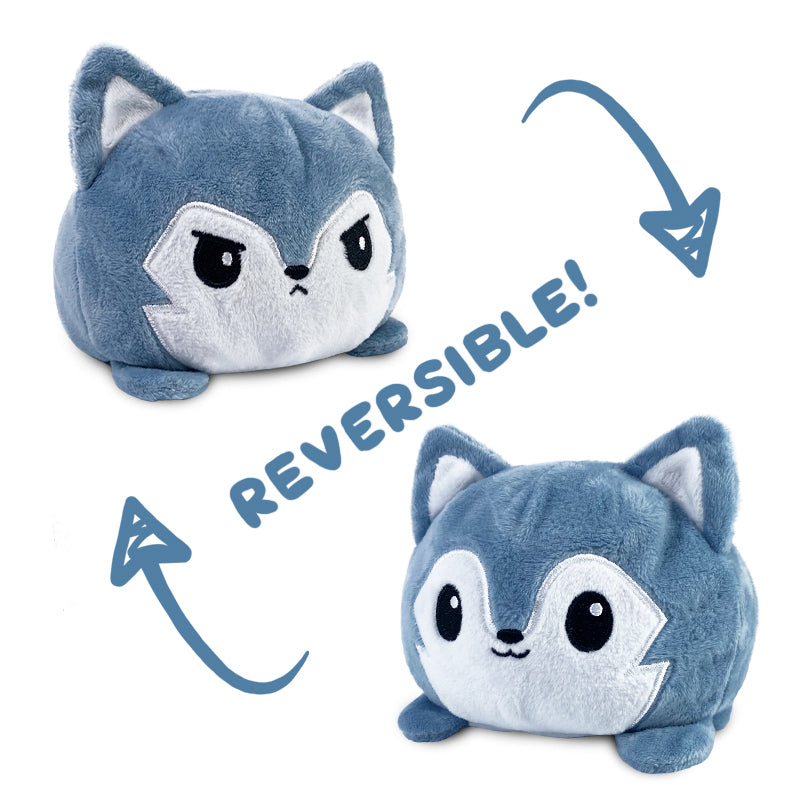 Two TeeTurtle Reversible Wolf Plushies with words.