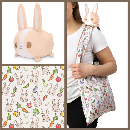 A woman is holding a Veggie Bunny Plushie Tote Bag with a bunny on it, made by TeeTurtle.