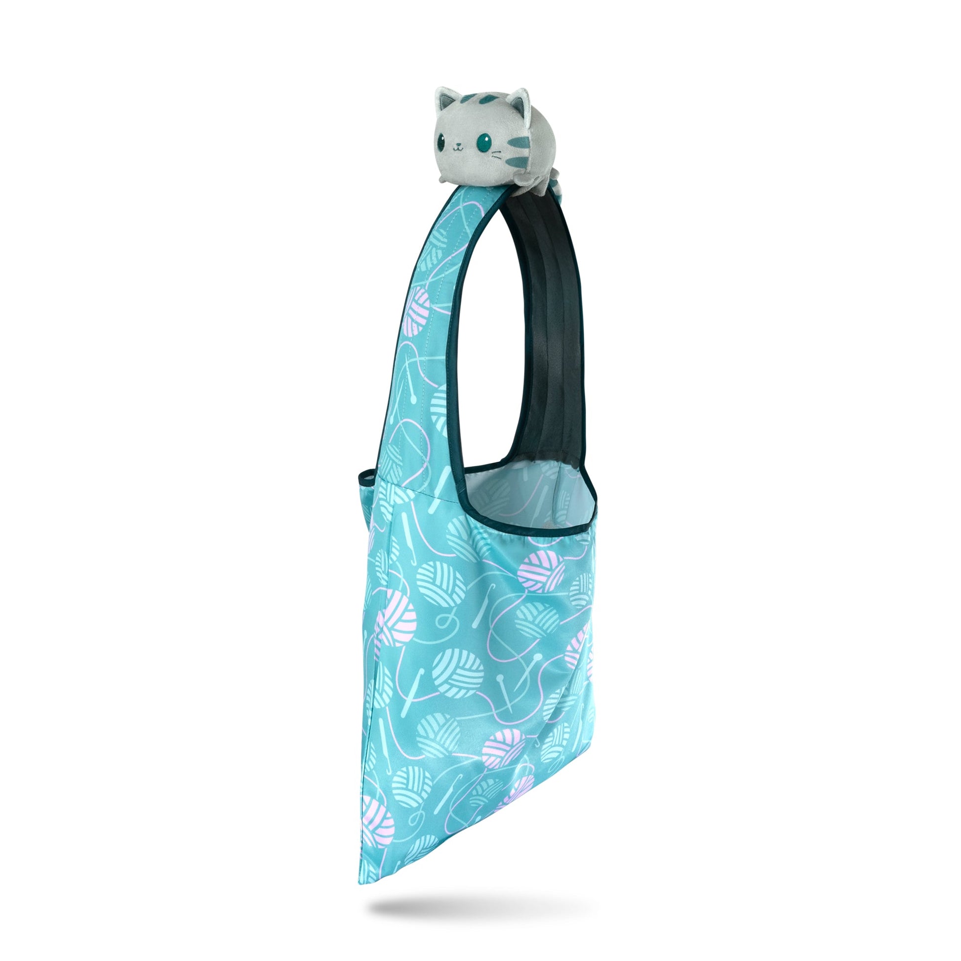 A Crafting Cat Plushie Tote Bag featuring a playful cat design.