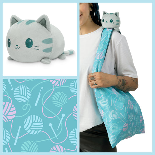 A woman is holding a TeeTurtle Crafting Cat Plushie Tote Bag.