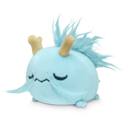 A Fantasy Dragon Plushie Tote Bag with long hair and horns, stored in a blue storage pouch by TeeTurtle.