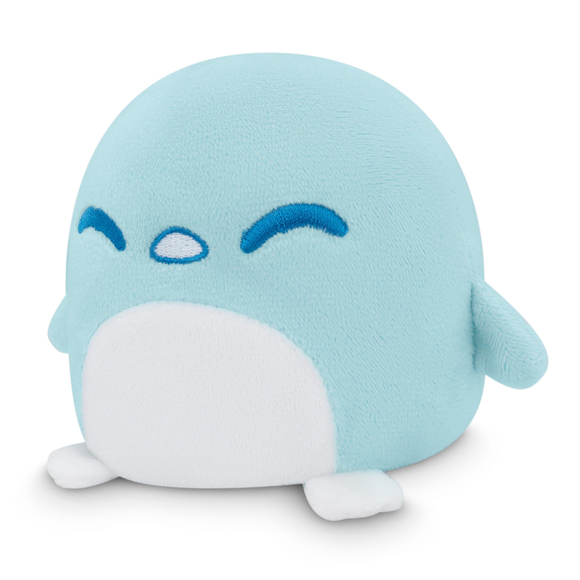 A blue Plushiverse Snowy Penguin plushie sitting on a white surface, perfect for TeeTurtle Velcro storage pouch or tote bag.