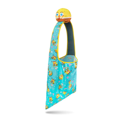 A blue and yellow child-size sling bag featuring a SpongeBob SquarePants theme, with a plush SpongeBob head at the top, made from recycled plastic bottles is called the Plushiverse SpongeBob SquarePants Jellyfishing Plushie Tote Bag by Nickelodeon.