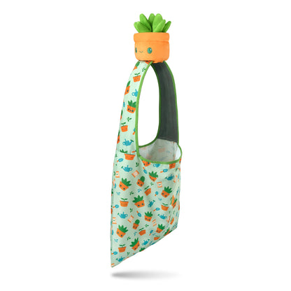 A Gardening Succulent Plushie Tote Bag with a pineapple print, perfect for storing TeeTurtle plushies.