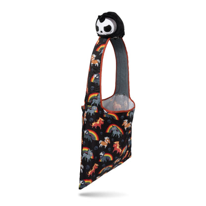 A Plushiverse Unicorns of the Apocalypse Plushie Tote Bag made by TeeTurtle, with a colorful pattern of rainbows and unicorns, featuring a plush panda head attached to the handle.