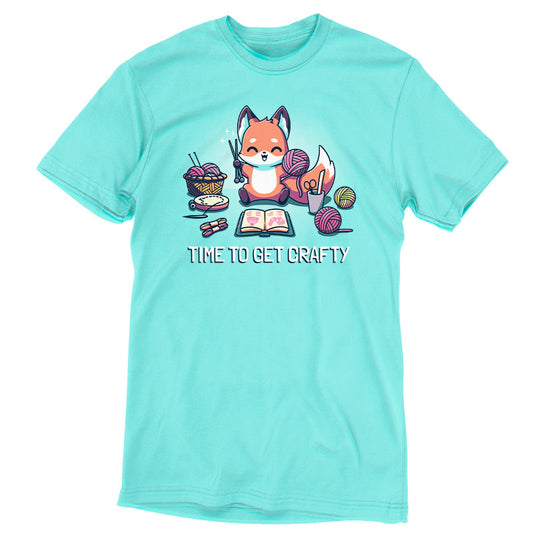 Premium Cotton T-shirt_TeeTurtle Time To Get Crafty Caribbean Blue t-shirt featuring an artistic happy fox holding yarn and crochet hooks surrounded by various crafting supplies.