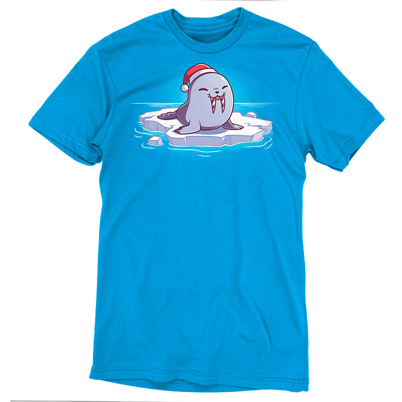 Premium Cotton T-shirt_TeeTurtle Sweet Tooth Cobalt Blue t-shirt featuring an illustration of a smiling walrus wearing a Santa hat, sitting on a floating ice. It's tusks are striped with red and white making them look like candy canes. It's also sticking out it's tongue. 