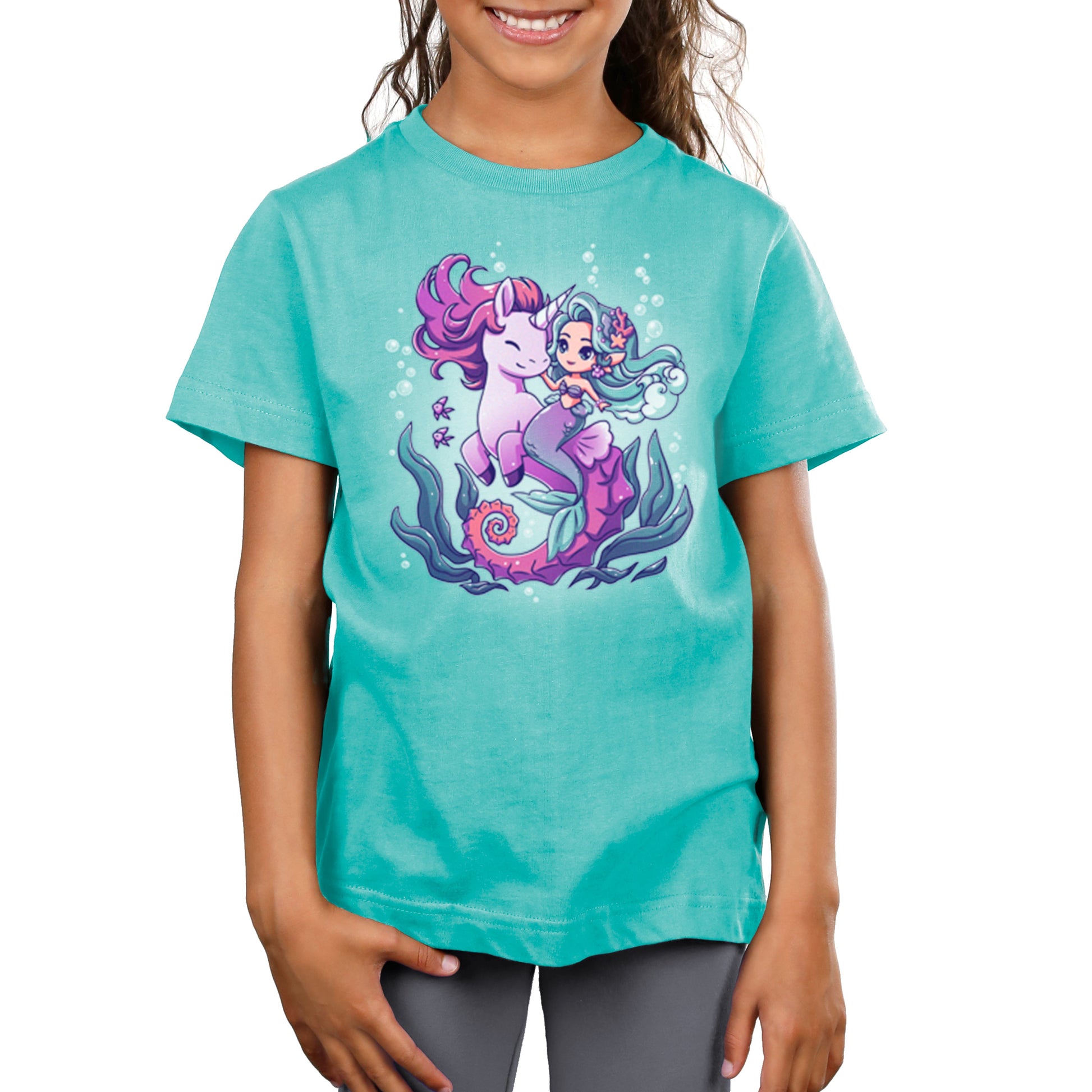 Premium Cotton T-shirt_Teeturtle BFFs (Sea Unicorn and Mermaid) Caribbean blue t-shirt featuring an illustrated image of a cheerful mermaid with teal hair riding a smiling purple unicorn underwater, surrounded by bubbles, fish, and sea plants.