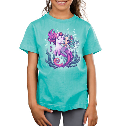 Premium Cotton T-shirt_Teeturtle BFFs (Sea Unicorn and Mermaid) Caribbean blue t-shirt featuring an illustrated image of a cheerful mermaid with teal hair riding a smiling purple unicorn underwater, surrounded by bubbles, fish, and sea plants.