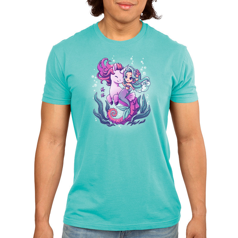 Premium Cotton T-shirt_Teeturtle BFFs (Sea Unicorn and Mermaid) Caribbean blue t-shirt featuring an illustrated image of a cheerful mermaid with teal hair riding a smiling purple unicorn underwater, surrounded by bubbles, fish, and sea plants.