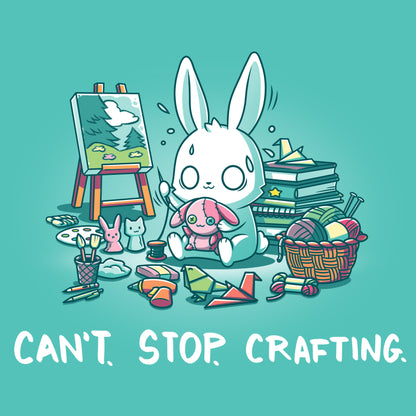 Premium Cotton T-shirt_TeeTurtle Can't. Stop. Crafting. Caribbean blue t-shirt featuring an illustration of a white rabbit with large, expressive eyes, and sweat droplets coming from its head sewing a small pink bunny surrounded by crafting materials like balls of yarn in a woven basket, paint pallets and brushes,  origami birds and other shapes, sewing thread, small stuffed animals, books stacked high, craft knives, and other crafting supplies, with the text "CAN'T. STOP. CRAFTING." at the bottom.