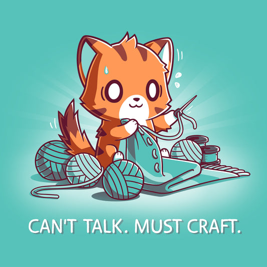 Premium Cotton T-shirt_Teeturtle Can't Talk. Must Craft caribbean blue t-shirt featuring a cat knitting with multiple yarn balls around and a concentrated expression. Text below reads 