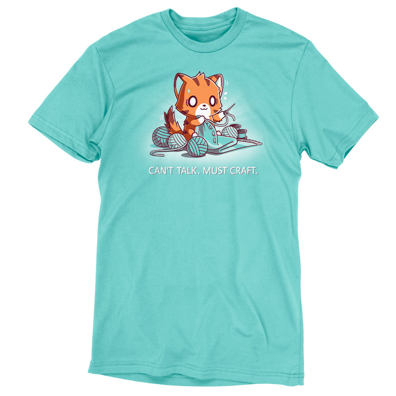 Premium Cotton T-shirt_Teeturtle Can't Talk. Must Craft caribbean blue t-shirt featuring a cat knitting with multiple yarn balls around and a concentrated expression. Text below reads "CAN'T TALK. MUST CRAFT."