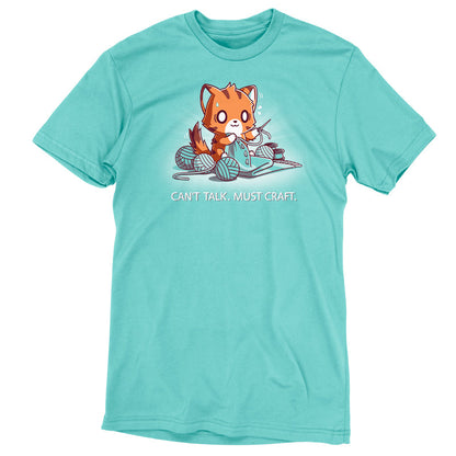 Premium Cotton T-shirt_Teeturtle Can't Talk. Must Craft caribbean blue t-shirt featuring a cat knitting with multiple yarn balls around and a concentrated expression. Text below reads "CAN'T TALK. MUST CRAFT."