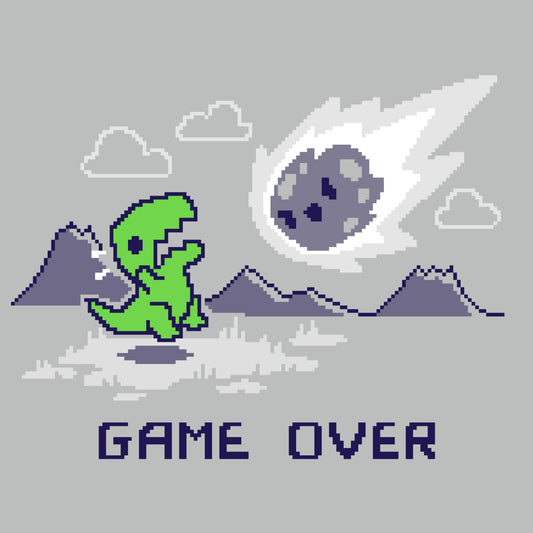 Premium Cotton T-shirt_TeeTurtle Game Over Dinosaur Silver t-shirt featuring Pixel art of a green dinosaur looking at a falling meteor, with mountains in the background