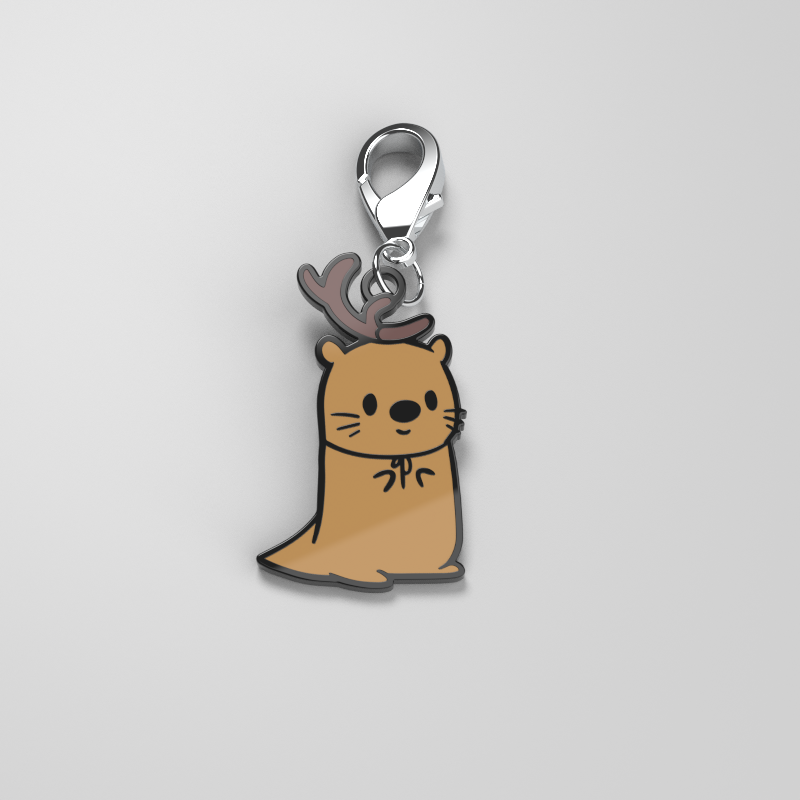 A brown cat charm with antlers on it, perfect as an All of the Otter Reindeer Enamel Keychain by TeeTurtle for your metal keys.