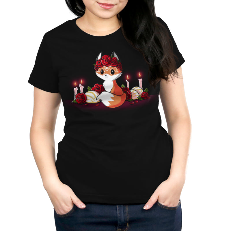 Premium Cotton T-shirt_TeeTurtle Dia de los Foxes black t-shirt featuring a cute little fox animal with Dia de los Muertos markings and wearing a crown of roses, surrounded by lit candles, roses and other Day of the Dead objects.