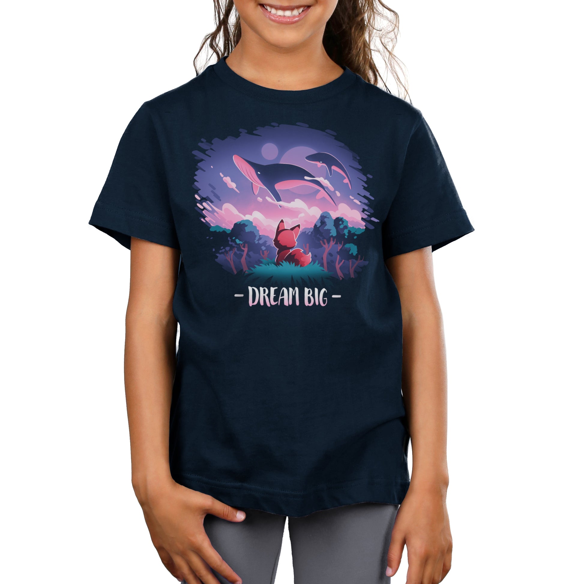 Premium Cotton T-shirt_TeeTurtle Dream Big navy blue t-shirt featuring an orange fox who gazes at magical whales flying in the night sky above a fantasy forest with the text "Dream Big" below.