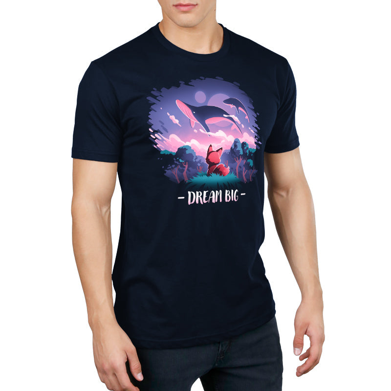 Premium Cotton T-shirt_TeeTurtle Dream Big navy blue t-shirt featuring an orange fox who gazes at magical whales flying in the night sky above a fantasy forest with the text "Dream Big" below.