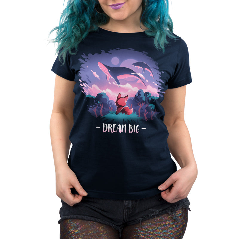 Premium Cotton T-shirt_TeeTurtle Dream Big navy blue t-shirt featuring an orange fox who gazes at magical whales flying in the night sky above a fantasy forest with the text "Dream Big" below.