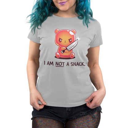 Premium Cotton T-shirt_TeeTurtle I Am Not A Snack silver gray t-shirt featuring a semi-translucent orange gummy bear holding a large kitchen knife looking angry. Beneath it there's text saying "I am not a snack"