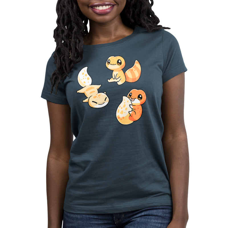 Premium Cotton T-shirt_TeeTurtle Lil Geckos denim blue t-shirt featuring three Lil' Geckos with varying yellow and orange patterns, sitting.