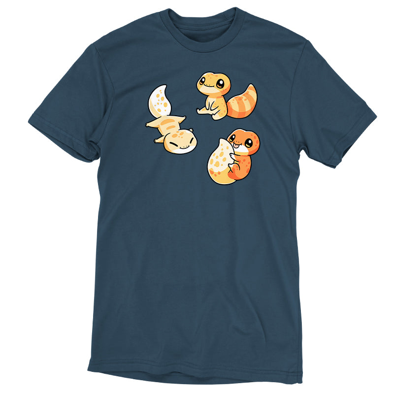 Premium Cotton T-shirt_TeeTurtle Lil Geckos denim blue t-shirt featuring three Lil' Geckos with varying yellow and orange patterns, sitting.