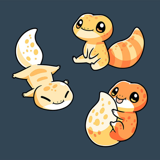 Premium Cotton T-shirt_TeeTurtle Lil Geckos denim blue t-shirt featuring three Lil' Geckos with varying yellow and orange patterns, sitting.