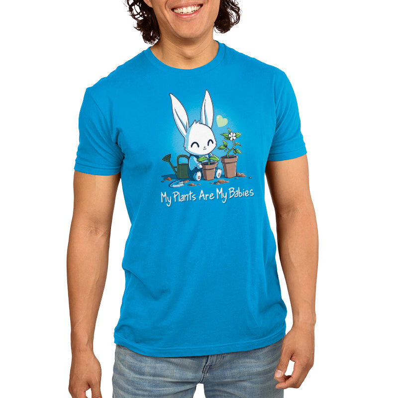 Premium Cotton T-shirt_Teeturtle My Plants Are My Babies cobalt blue t-shirt featuring a smiling bunny watering two potted plants with the phrase "My Plants Are My Babies" written below.