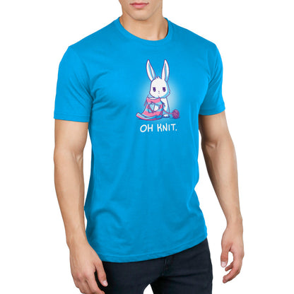 Premium Cotton T-shirt_Teeturtle Oh Knit Cobalt Blue featuring a white rabbit looking distraught. It's holding two knitting needles attached to a blue and pink striped scarf that has a large hole in the middle. There is a ball of pink yarn trailing off to the side and text beneath it that says "Oh knit."