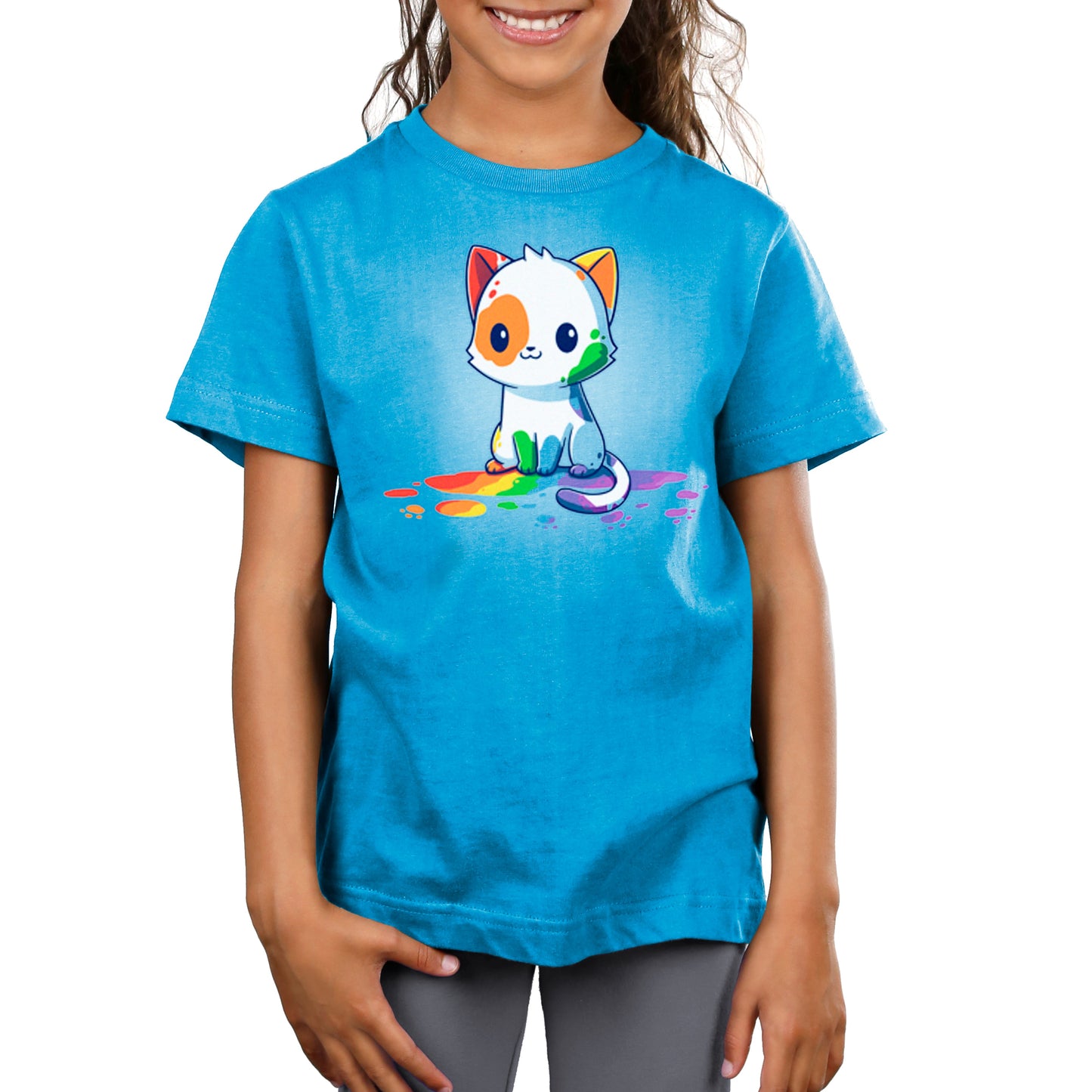 Premium Cotton T-shirt_TeeTurtle Rainbow Cat Cobalt Blue t-shirt featuring an illustration of a white cartoon kitten with colorful paint splashes on its body, sitting on a floor with rainbow-colored paint drops around it. 