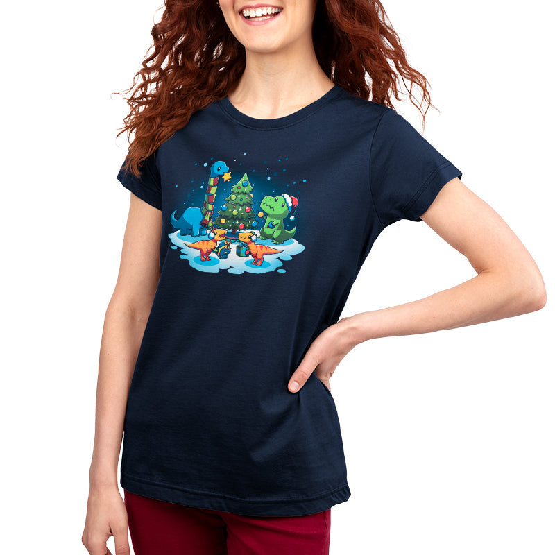 Premium Cotton T-shirt_TeeTurtle A Very Dino Christmas navy blue t-shirt featuring dinosaurs celebrating around a decorated Christmas tree with snow on the ground and dinosaurs holding presents.