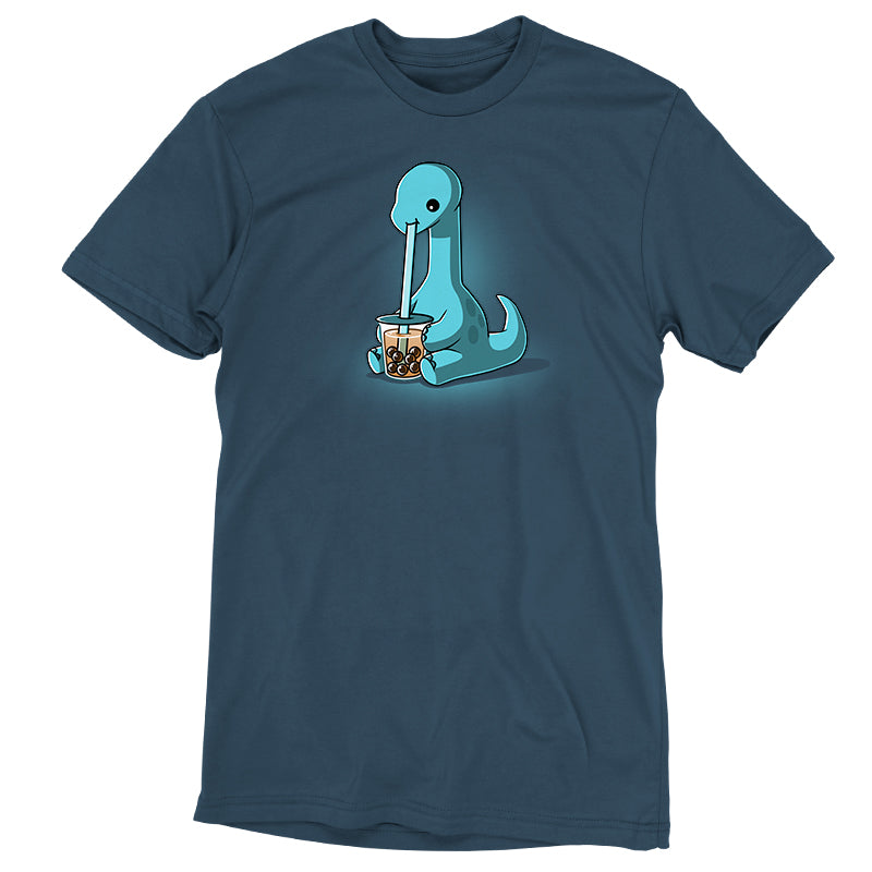 Premium Cotton T-shirt_TeeTurtle Boba Dinosaur Denim t-shirt featuring a cartoon dinosaur sipping bubble tea through a large straw. The dinosaur is blue with a long neck and tail, seated against a dark background. 