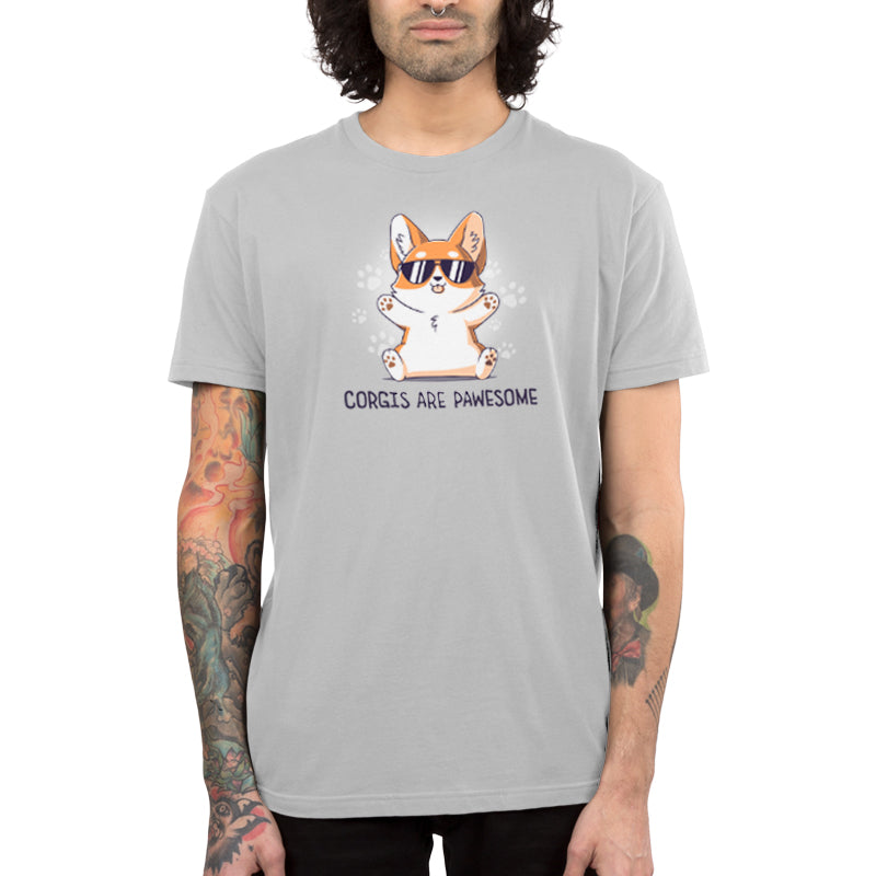 Premium Cotton T-shirt_TeeTurtle Corgis Are Pawsome Silver Gray t-shirt featuring an illustration of a corgi wearing sunglasses with its tongue out, sitting and smiling. The background has paw prints and the text "Corgis are PAWESOME" is written at the bottom. 