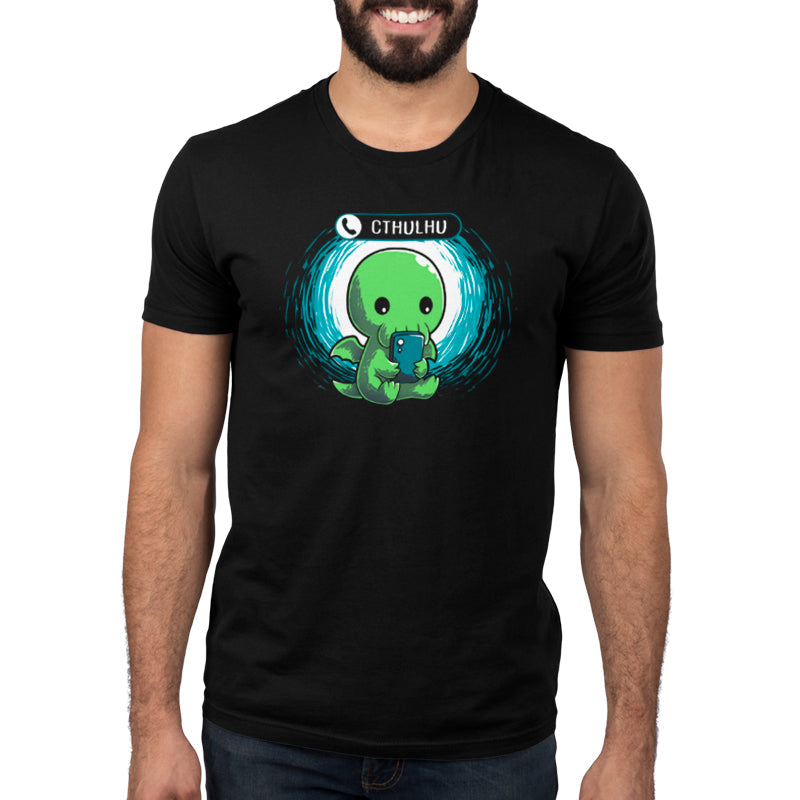 Premium Cotton T-shirt_TeeTurtle Cthulhu Calling black t-shirt featuring a Cthulhu holding a smartphone and looking at the screen with an incoming call notification displaying "Cthulhu" at the top.