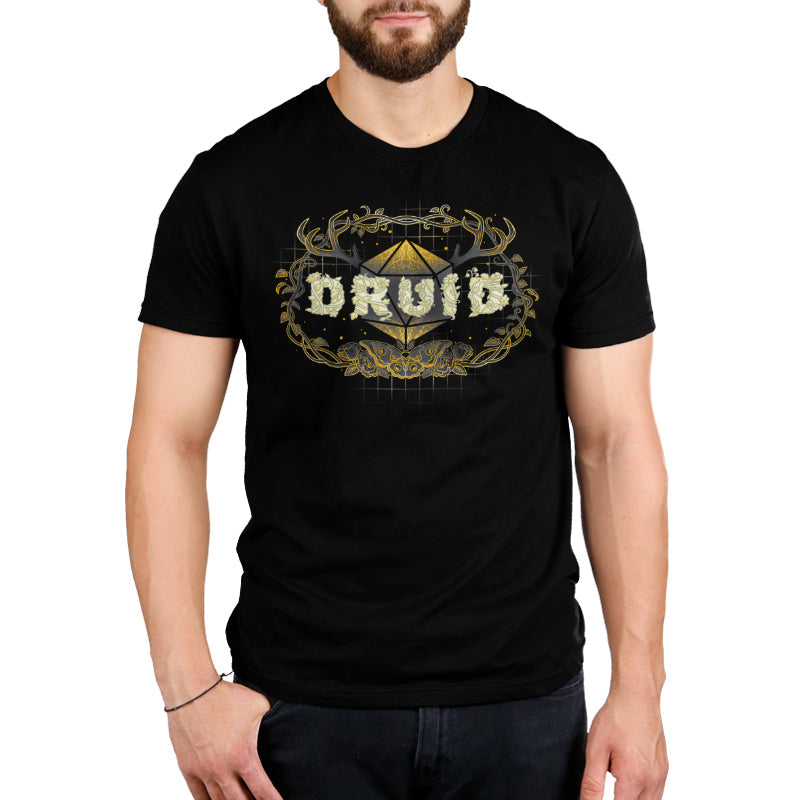 Premium Cotton T-shirt_TeeTurtle Druid Class black t-shirt featuring a stylized "DRUID" text made of floral designs overlaying a geometric shape, framed by antlers and vines with a butterfly at the bottom, all in gold and cream tones for tabletop gaming. 