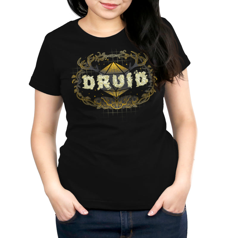 Premium Cotton T-shirt_TeeTurtle Druid Class black t-shirt featuring a stylized "DRUID" text made of floral designs overlaying a geometric shape, framed by antlers and vines with a butterfly at the bottom, all in gold and cream tones for tabletop gaming. 