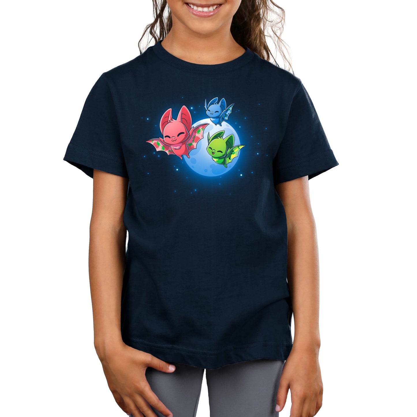 Premium Cotton T-shirt_TeeTurtle Fruit Bats navy blue t-shirt featuring three colorful fruit bats (red, green, blue) with decorative wings flying against a night sky with a full moon and stars.