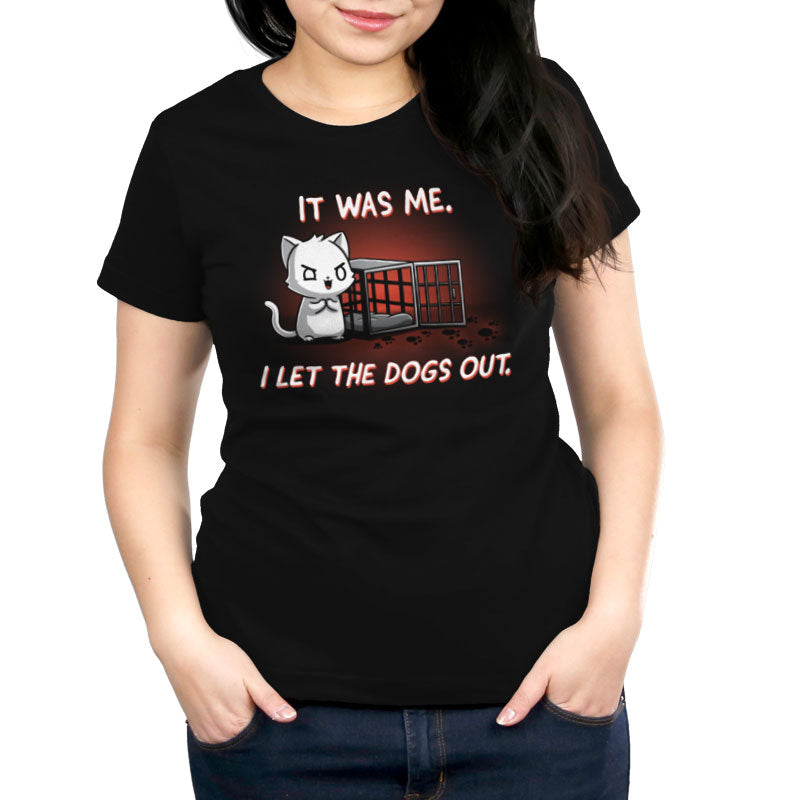 Premium Cotton T-shirt_TeeTurtle I let the dogs out black t-shirt featuring a cat next to an empty dog cage.