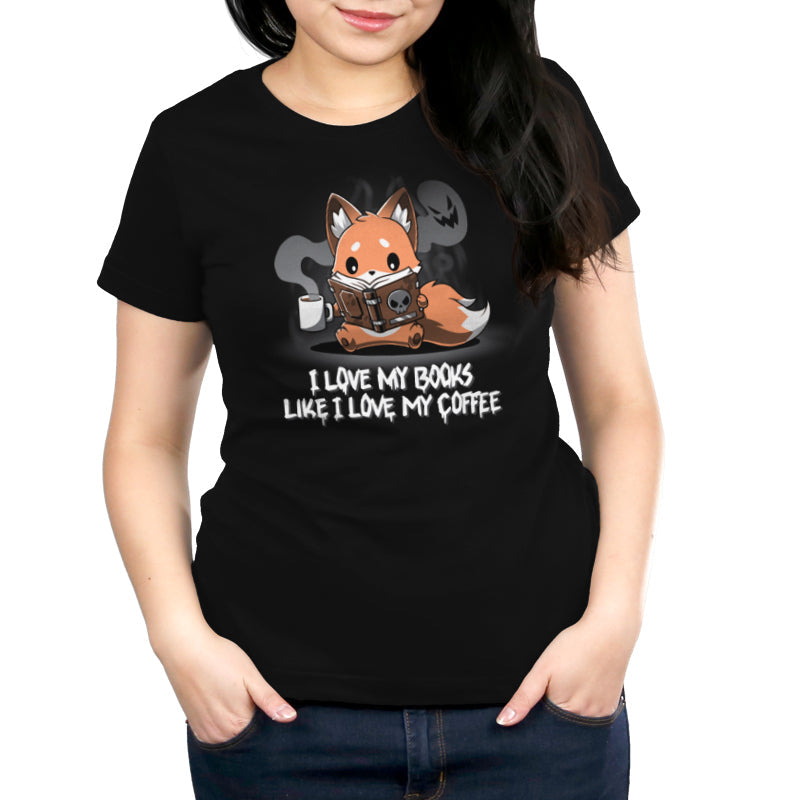 Premium Cotton T-shirt_Teeturtle I Love My Books Like I Love My Coffee black t-shirt featuring a fox holding a steaming coffee cup and reading a book with a skull on the cover. Text below reads: "I love my books like I love my coffee."