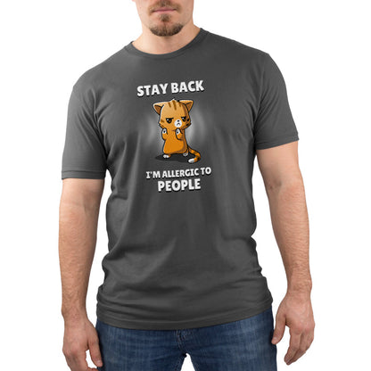 Premium Cotton T-shirt_TeeTurtle I'm Allergic to People charcoal gray t-shirt featuring an orange cat with a stern expression raising its paws, surrounded by text reading, "STAY BACK. I'M ALLERGIC TO PEOPLE".