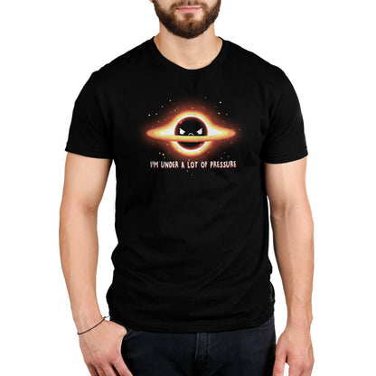 Premium Cotton T-shirt_Teeturtle I'm Under a Lot of Pressure black t-shirt featuring a planet with rings, depicting an angry expression. There are surrounding stars and text that reads: "I'M UNDER A LOT OF PRESSURE."