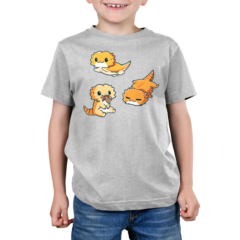 Premium Cotton T-shirt_TeeTurtle Lil Bearded Dragons Silver Gray t-shirt featuring three cartoon-style illustrations of Lil' Bearded Dragons in various poses: sitting and holding food, laying down, and standing on all fours with a happy expression.