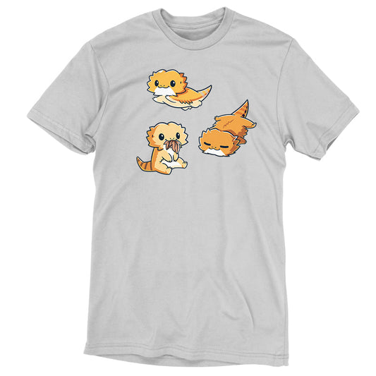 Premium Cotton T-shirt_TeeTurtle Lil Bearded Dragons Silver Gray t-shirt featuring three cartoon-style illustrations of Lil' Bearded Dragons in various poses: sitting and holding food, laying down, and standing on all fours with a happy expression.